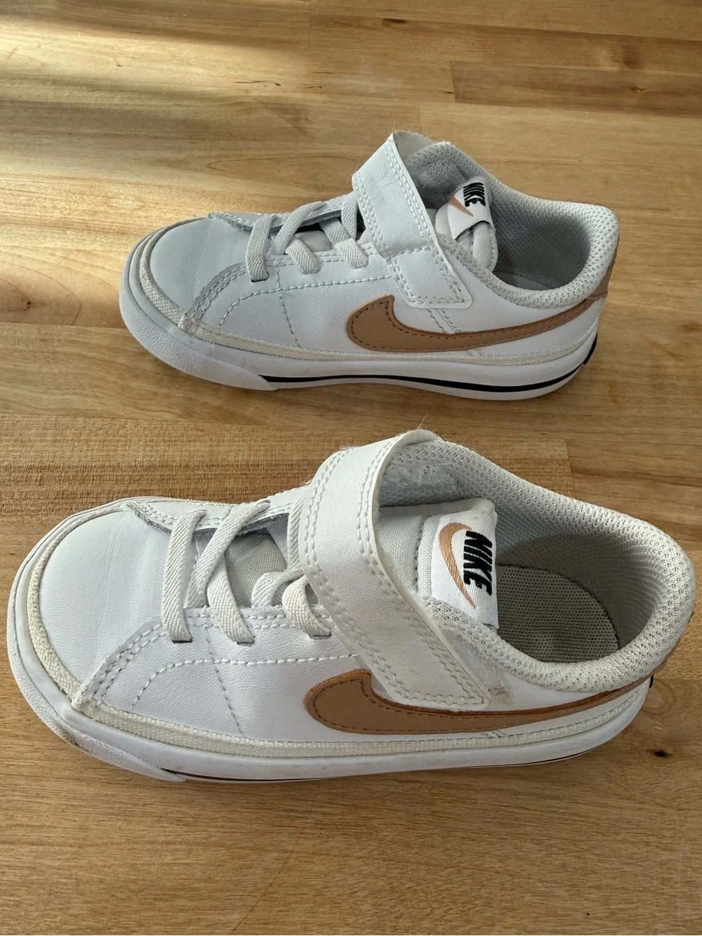 Nike Kids White Sneakers with Metallic Gold Swoosh